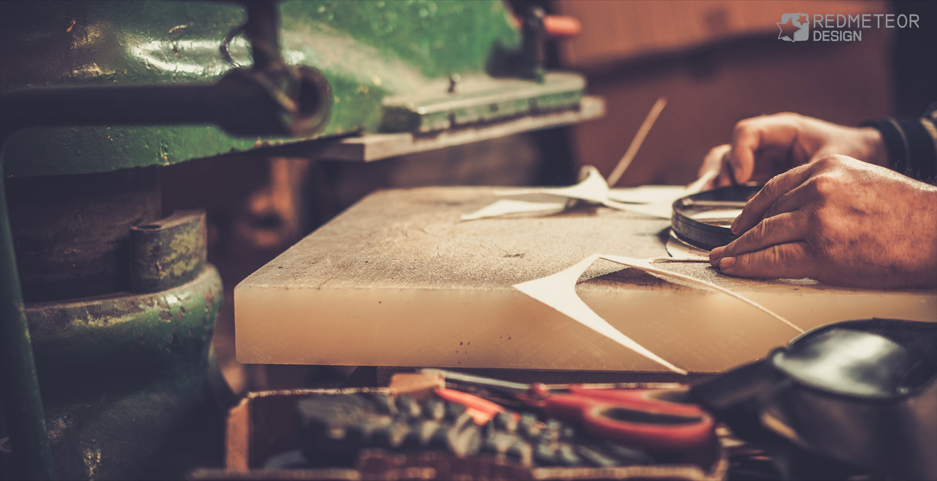 Leather being cut by hand
